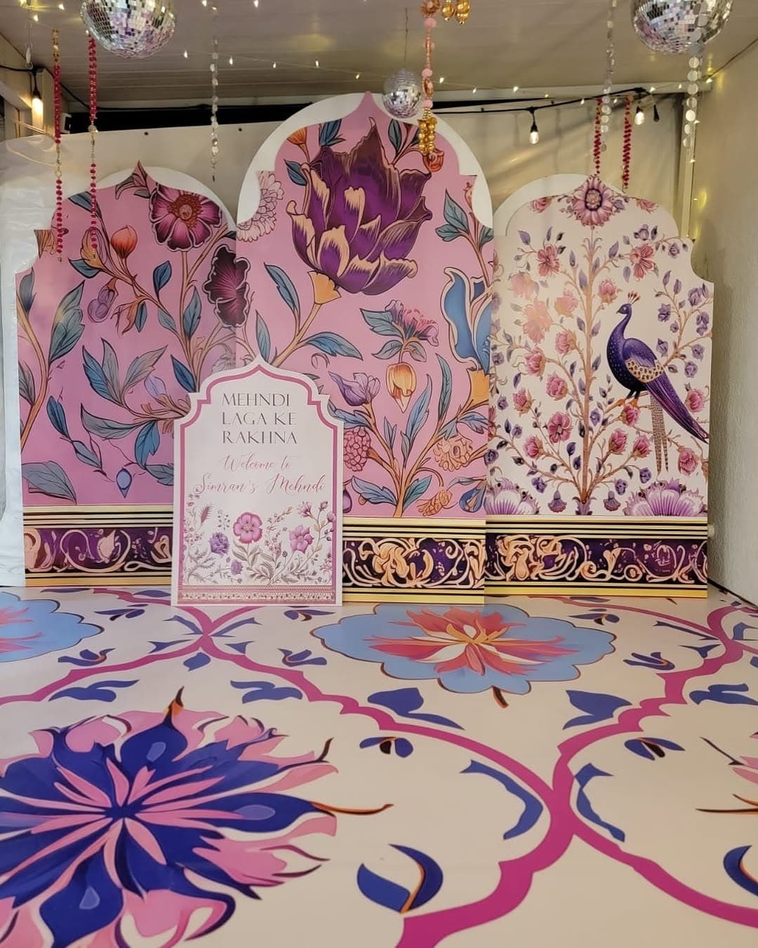Colorful South Asian mehndi ceremony with custom patterned dance floor