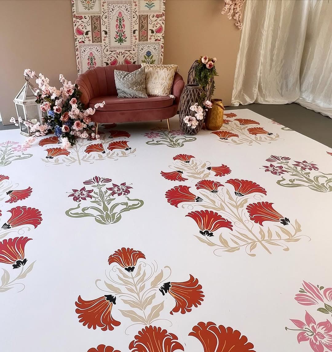 Custom floral dance floor design with gold accents